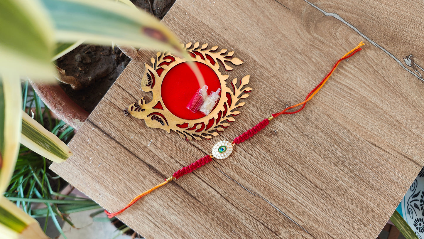 Oval golden peacock Macrame Rakhi