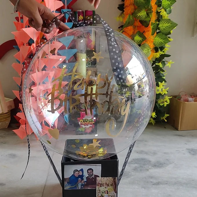 Box with floating balloon